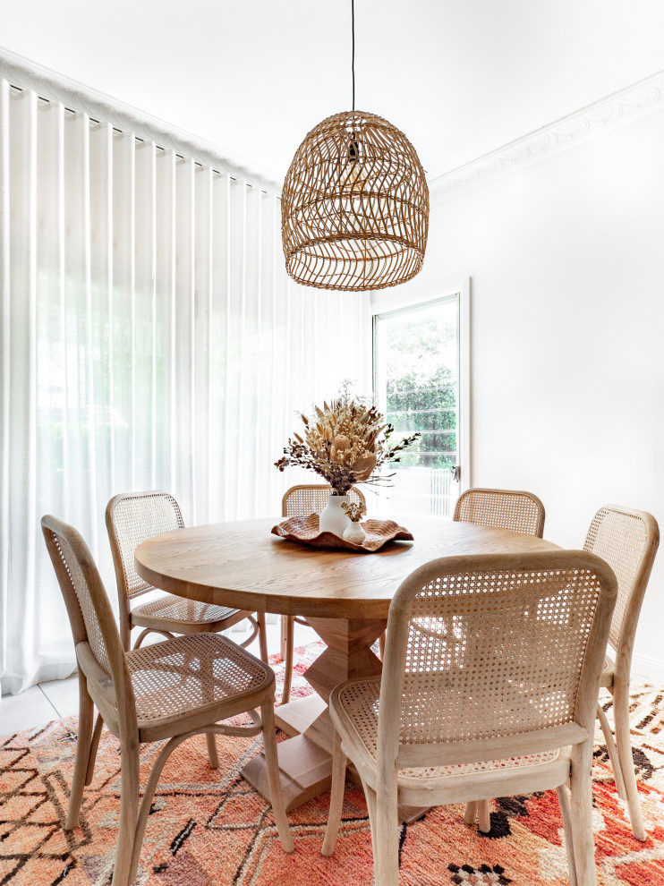 This is an example of a beach style dining room in Sydney.