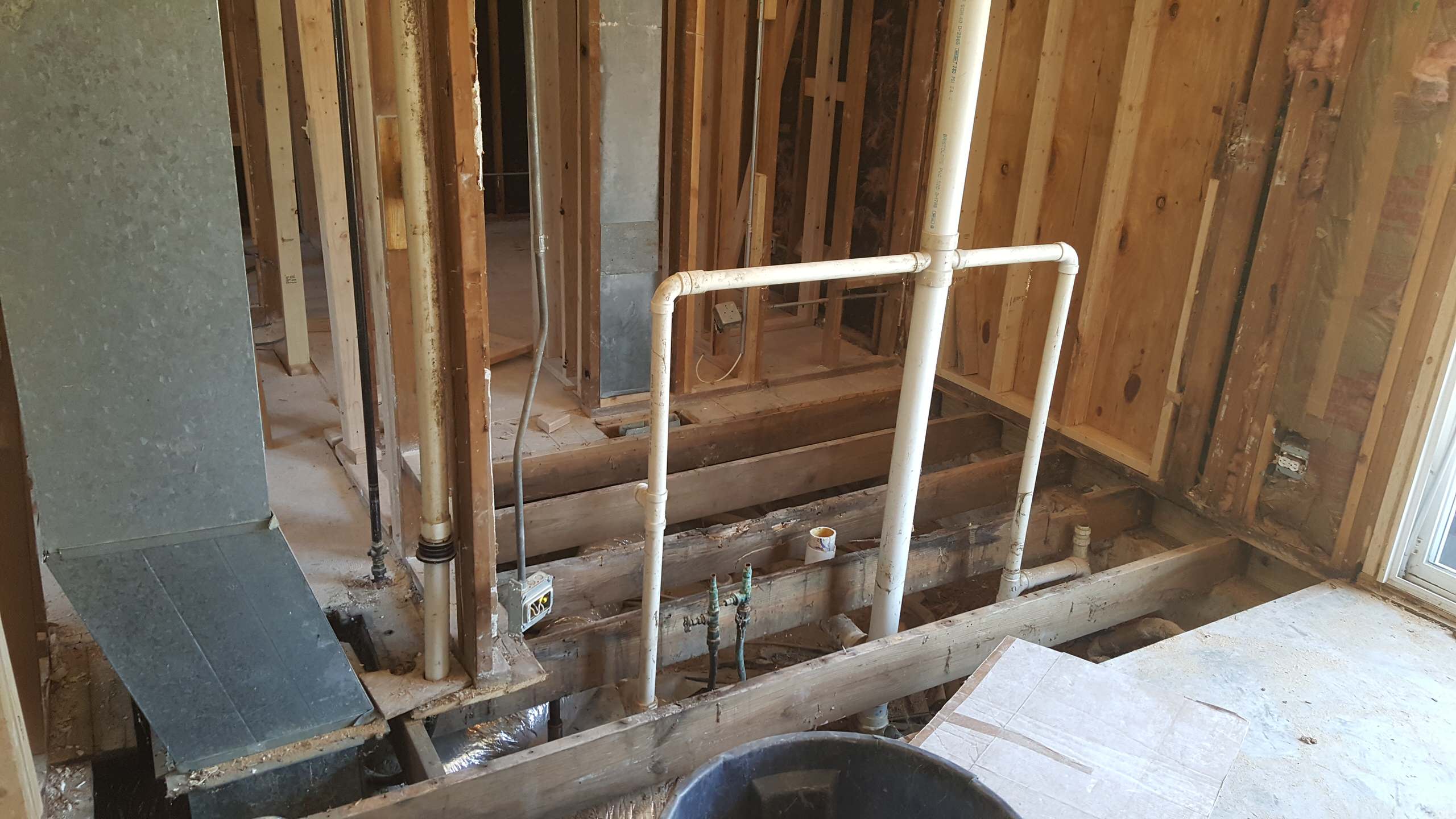 Bathroom Stripped to framing with new exterior shower wall