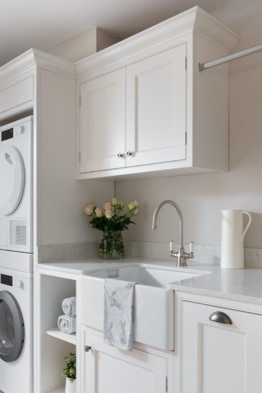 Design ideas for a large classic utility room in Hampshire with a belfast sink, shaker cabinets, grey cabinets, wood worktops, stone tiled splashback, limestone flooring, beige floors and grey worktops.