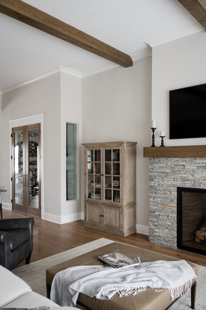 Inspiration for a mid-sized modern formal open concept living room in Indianapolis with white walls, medium hardwood floors, a standard fireplace, a stone fireplace surround and no tv.
