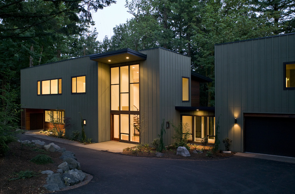 Design ideas for a contemporary two-storey exterior in Portland with wood siding.
