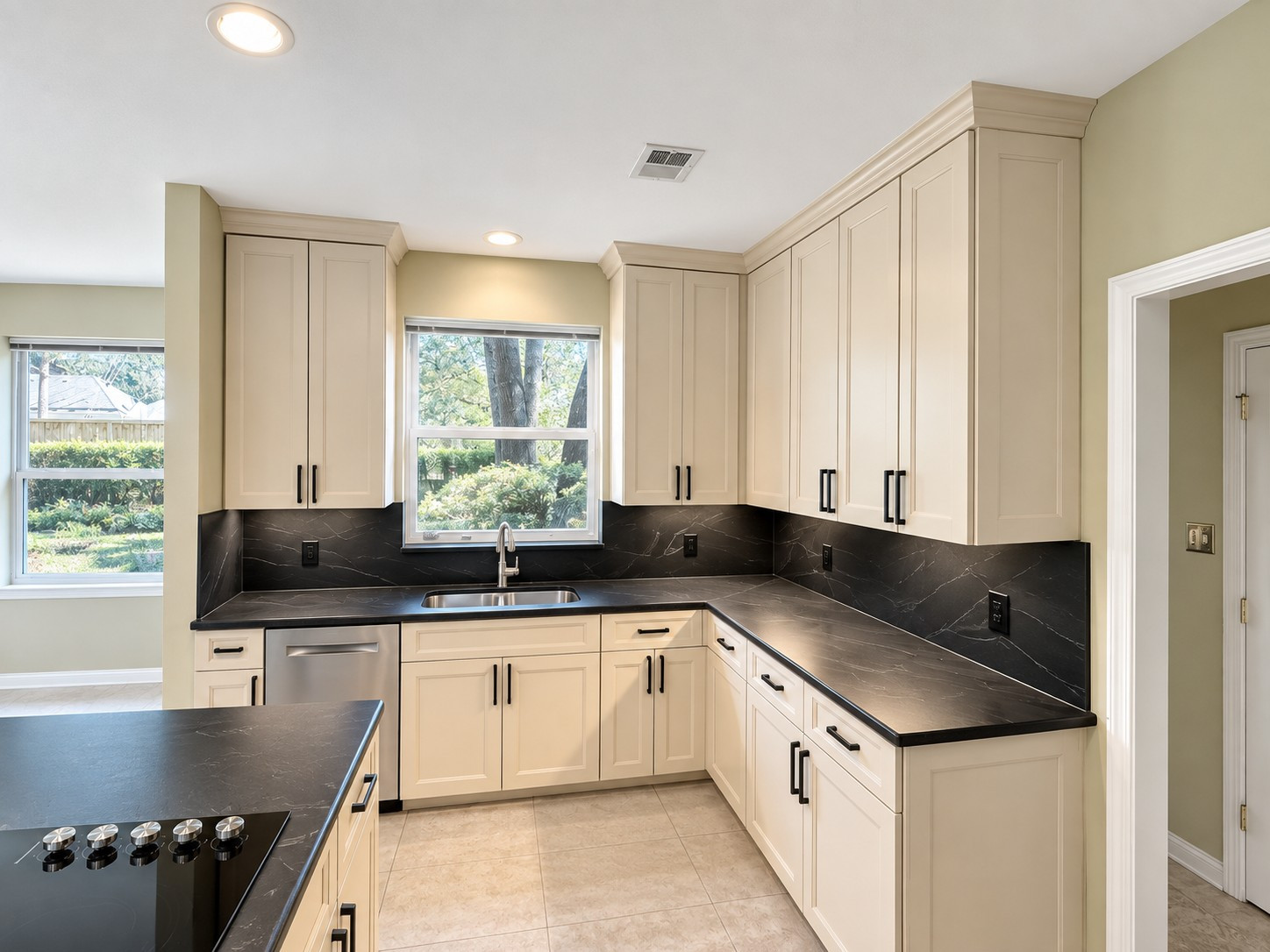 Custom Transitional Kitchen with Cream Shaker Cabinets & Black Countertops