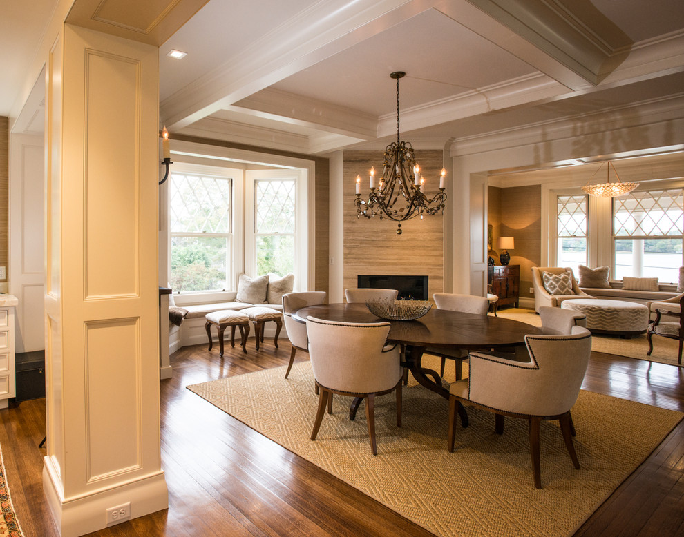 Photo of a mid-sized transitional open plan dining in Boston with beige walls, dark hardwood floors, a corner fireplace and a stone fireplace surround.