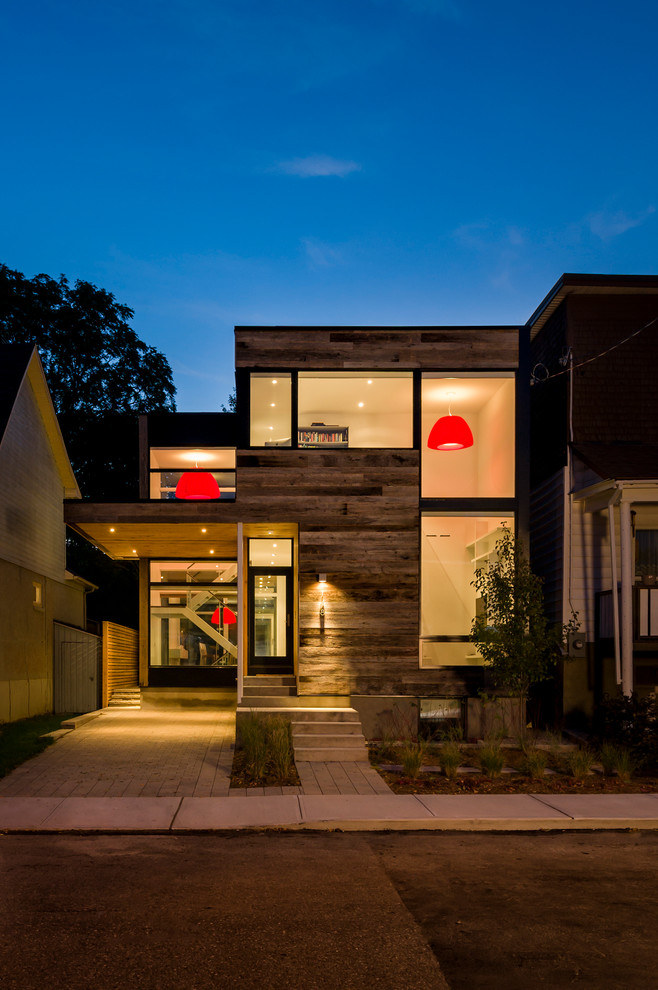Inspiration for a contemporary exterior in Ottawa with wood siding.