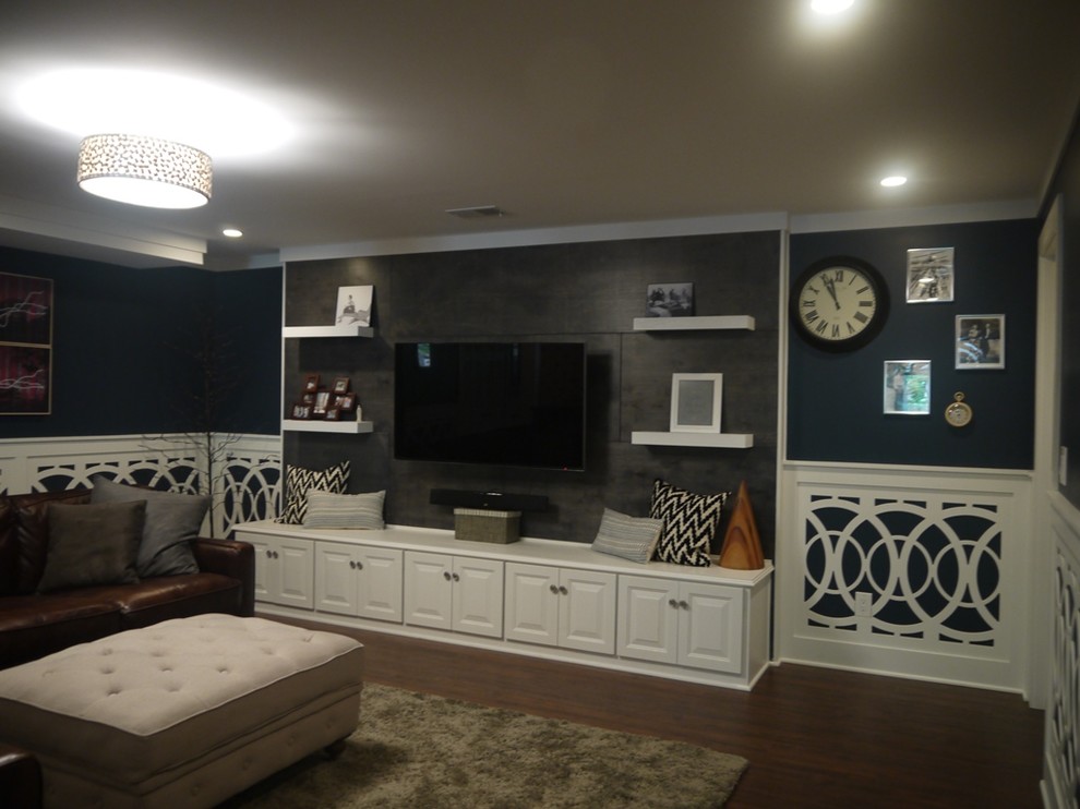 Photo of an expansive transitional basement in Kansas City with a game room, blue walls and dark hardwood floors.