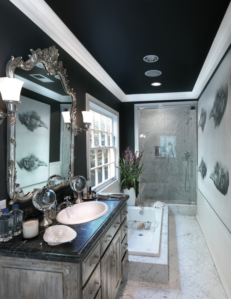 Design ideas for a traditional bathroom in Los Angeles with a drop-in sink, raised-panel cabinets, distressed cabinets, a drop-in tub, an alcove shower, white tile and black walls.