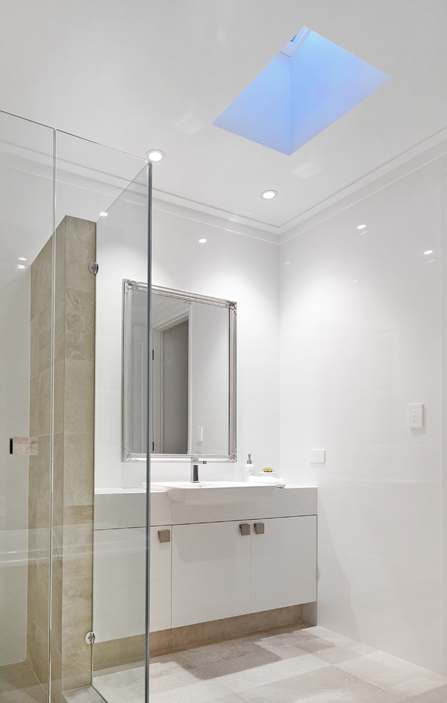Photo of a contemporary kids bathroom in Perth with flat-panel cabinets, white cabinets, engineered quartz benchtops, a drop-in tub, yellow walls and porcelain floors.