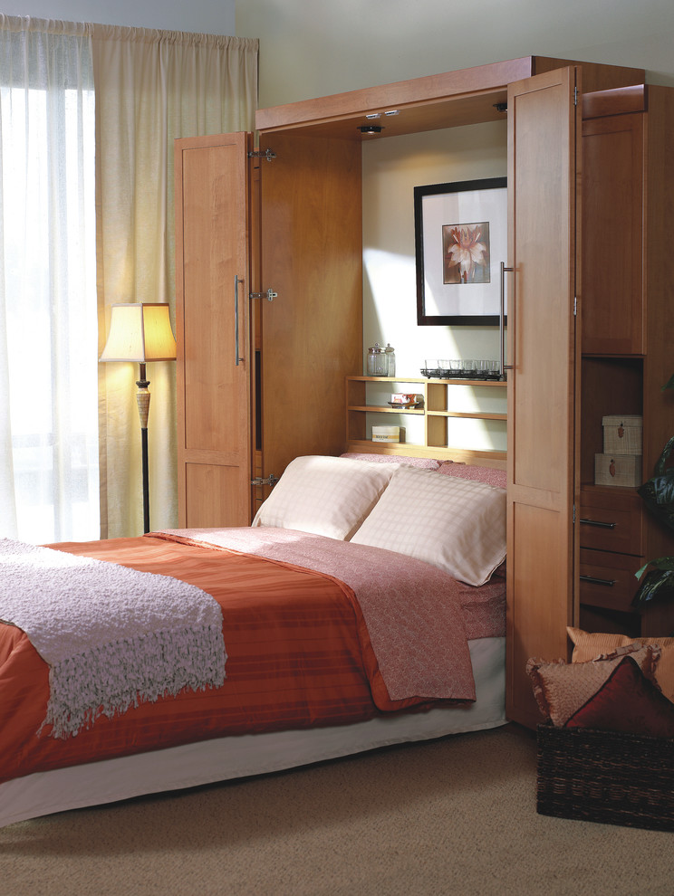 Example of a mid-sized transitional carpeted and brown floor bedroom design in Miami with beige walls and no fireplace