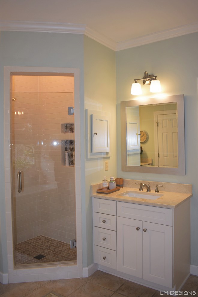 Mid-sized transitional master white tile and subway tile ceramic tile and beige floor alcove bathtub photo with recessed-panel cabinets, white cabinets, green walls, an undermount sink, marble countertops, a hinged shower door and beige countertops