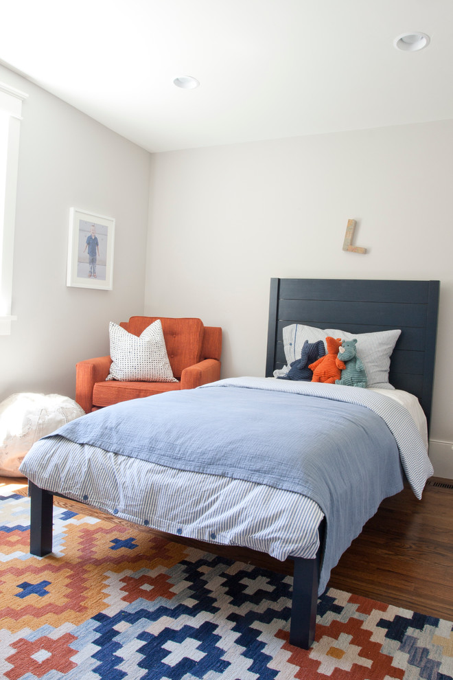 Photo of a contemporary gender-neutral kids' bedroom for kids 4-10 years old in Salt Lake City with grey walls and medium hardwood floors.