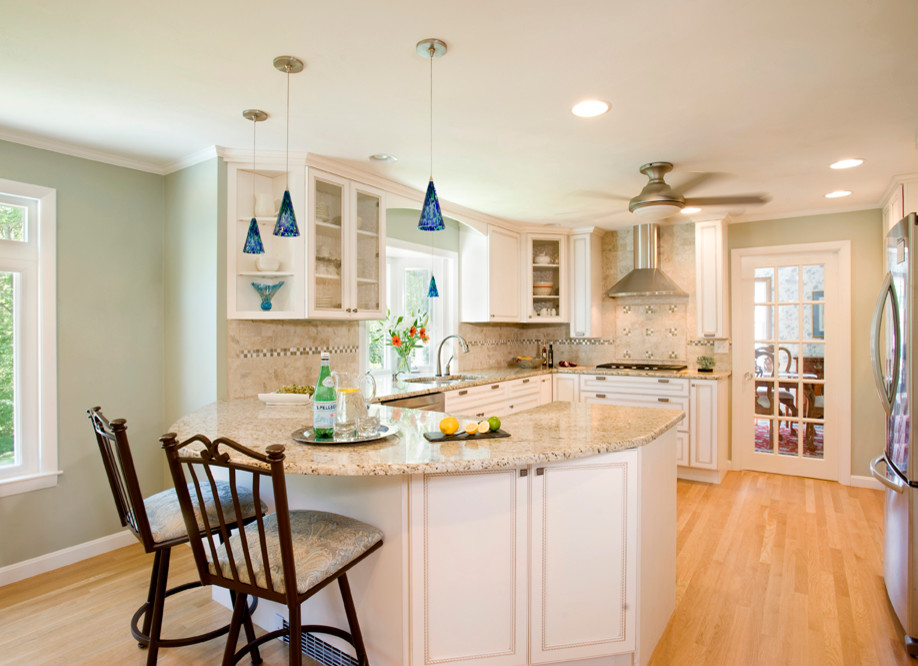 Mid-sized transitional u-shaped light wood floor eat-in kitchen photo in Boston with a double-bowl sink, recessed-panel cabinets, white cabinets, granite countertops, multicolored backsplash, ceramic backsplash, stainless steel appliances and a peninsula
