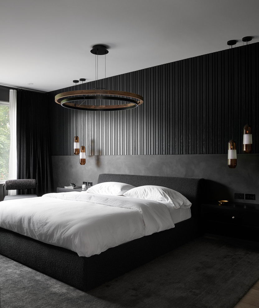 Idee per una grande camera matrimoniale minimal con pareti nere, pavimento in legno massello medio e pareti in legno