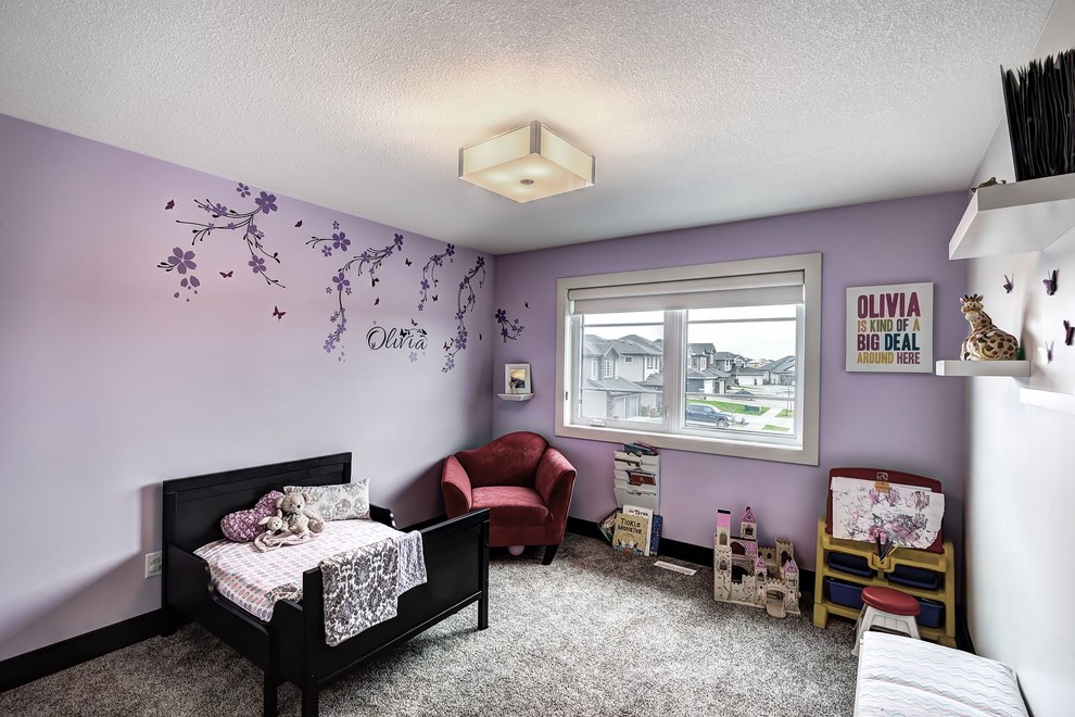 Inspiration for a mid-sized contemporary kids' room for girls in Edmonton with blue walls and carpet.