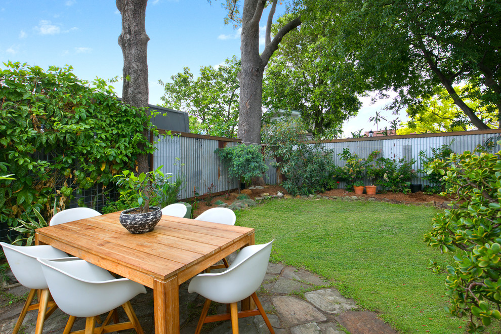 Photo of a country backyard garden in Sydney with a vertical garden and brick pavers.