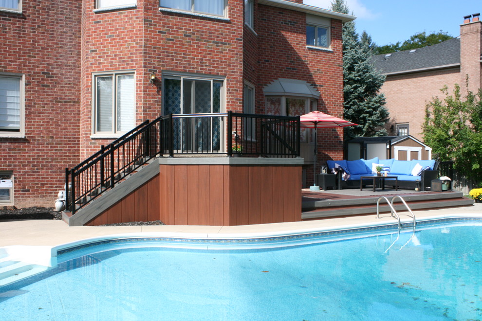 This is an example of a modern backyard deck in Toronto with no cover.