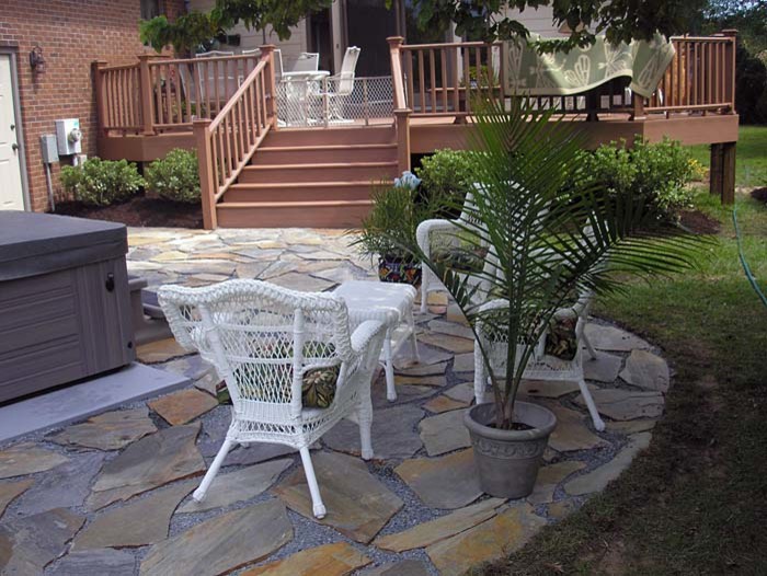 Photo of a mid-sized partial sun backyard landscaping.