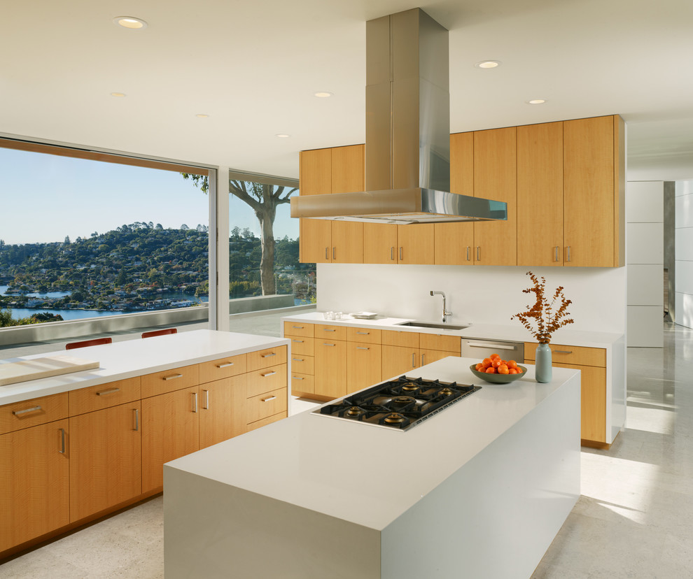 Inspiration for a contemporary l-shaped kitchen in San Francisco with flat-panel cabinets and light wood cabinets.