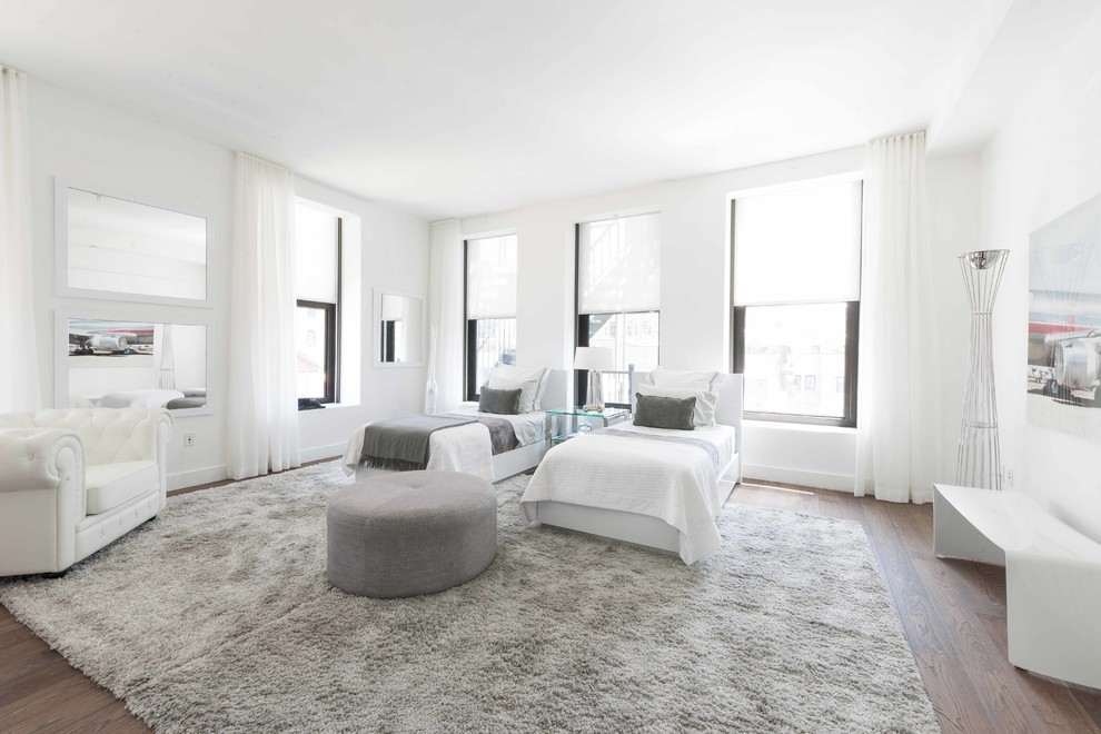 Inspiration for a contemporary bedroom in New York with white walls and dark hardwood floors.