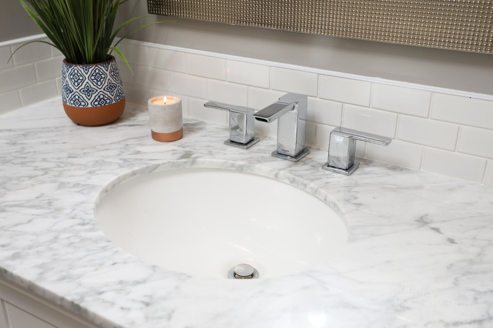 Inspiration for a mid-sized transitional white tile gray floor alcove bathtub remodel with shaker cabinets, white cabinets, a one-piece toilet, gray walls, an undermount sink and gray countertops