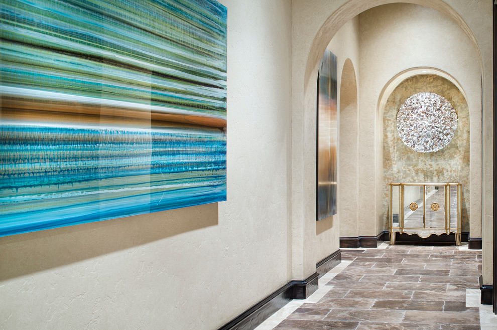 Mediterranean hallway in Houston with beige walls.