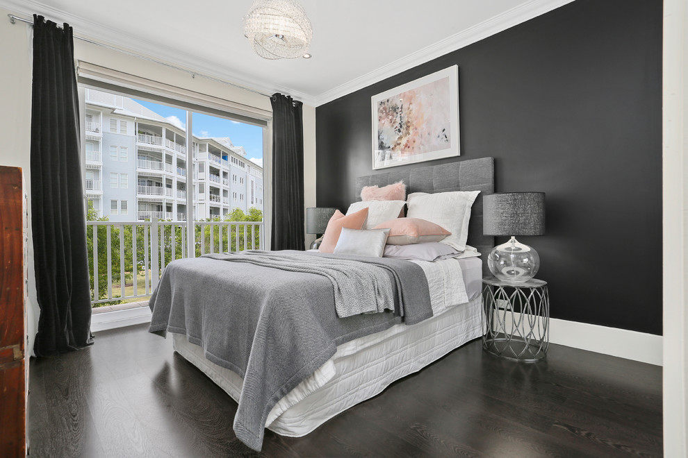 This is an example of a transitional bedroom in Sydney with black walls and black floor.