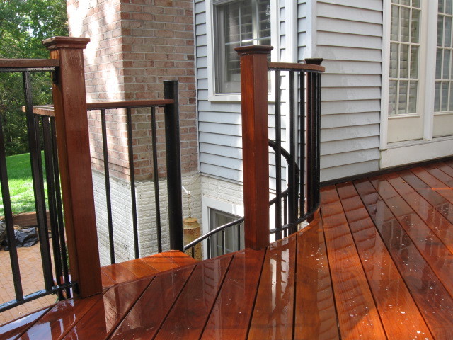 Decks And Patios Herndon  Elevated curved Ipe deck in Herndon, VA, with spiral staircase. eclectic-deck