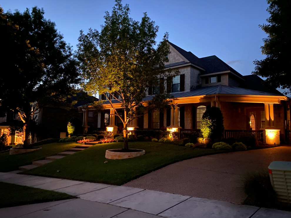 This is an example of a mid-sized contemporary full sun front yard concrete paver landscaping in Dallas for spring.