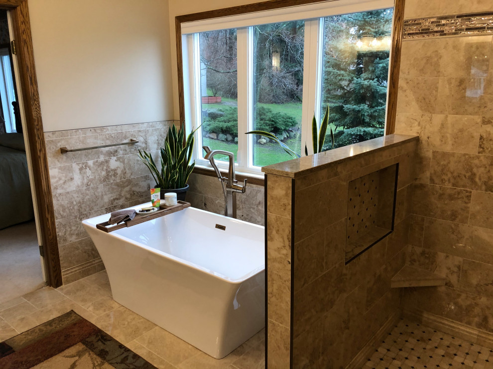Inspiration for a mid-sized transitional master beige tile double-sink and beige floor bathroom remodel in Cleveland with shaker cabinets, brown cabinets, a built-in vanity, quartz countertops, an undermount sink, beige countertops, a one-piece toilet and beige walls