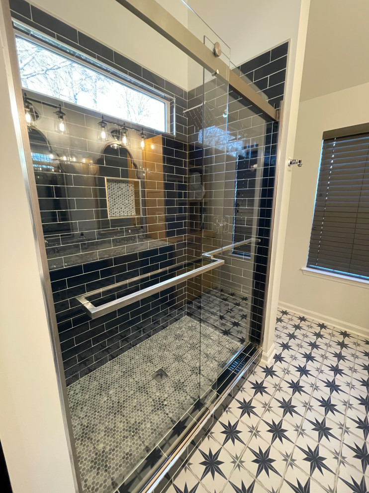 Modern bathroom in Atlanta with shaker cabinets, blue cabinets, an open shower, a one-piece toilet, blue tile, ceramic tile, white walls, ceramic floors, an undermount sink, marble benchtops, multi-coloured floor, a sliding shower screen, yellow benchtops, a niche, a double vanity, a freestanding vanity and vaulted.