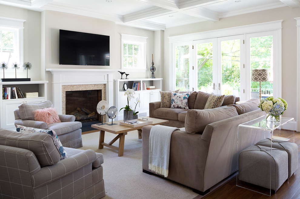 Inspiration for a large transitional open concept family room in DC Metro with beige walls, medium hardwood floors, a standard fireplace, a wall-mounted tv, a stone fireplace surround and grey floor.