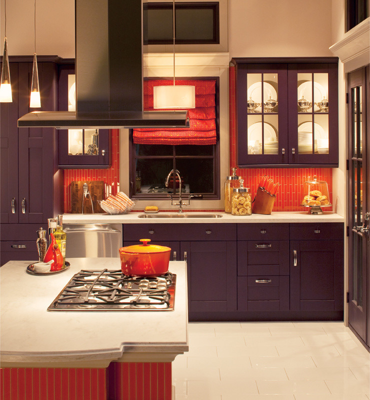 Inspiration for a large traditional l-shaped eat-in kitchen in New York with a drop-in sink, shaker cabinets, purple cabinets, solid surface benchtops, orange splashback, mosaic tile splashback, stainless steel appliances, ceramic floors, with island and beige floor.