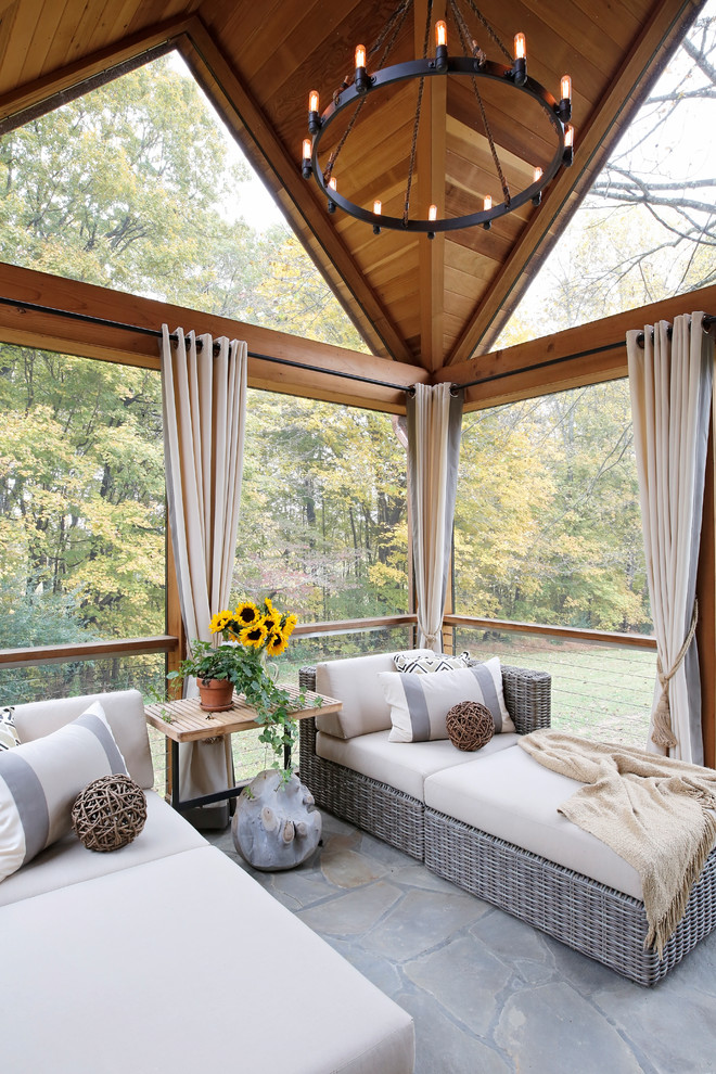 Country sunroom in Nashville with a skylight and grey floor.