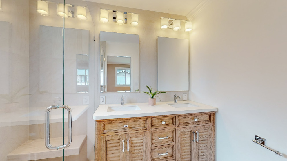 This is an example of a bathroom in San Francisco with brown cabinets, a corner shower, multi-coloured tile, marble, white walls, painted wood floors, an undermount sink, quartzite benchtops, orange floor, a sliding shower screen, white benchtops, a niche, a double vanity and a built-in vanity.