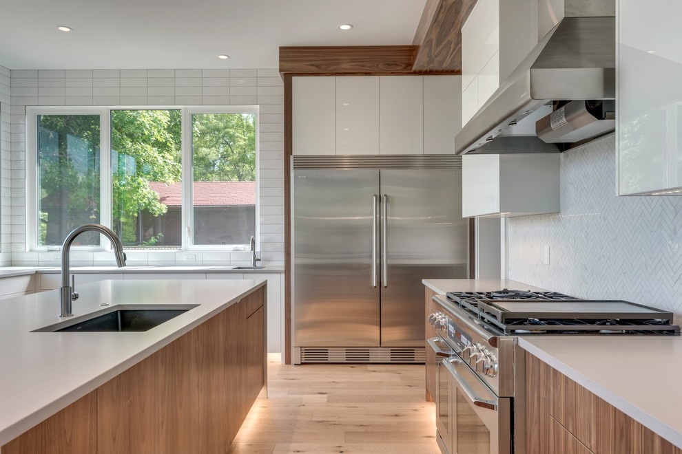 Example of a transitional kitchen design in Calgary