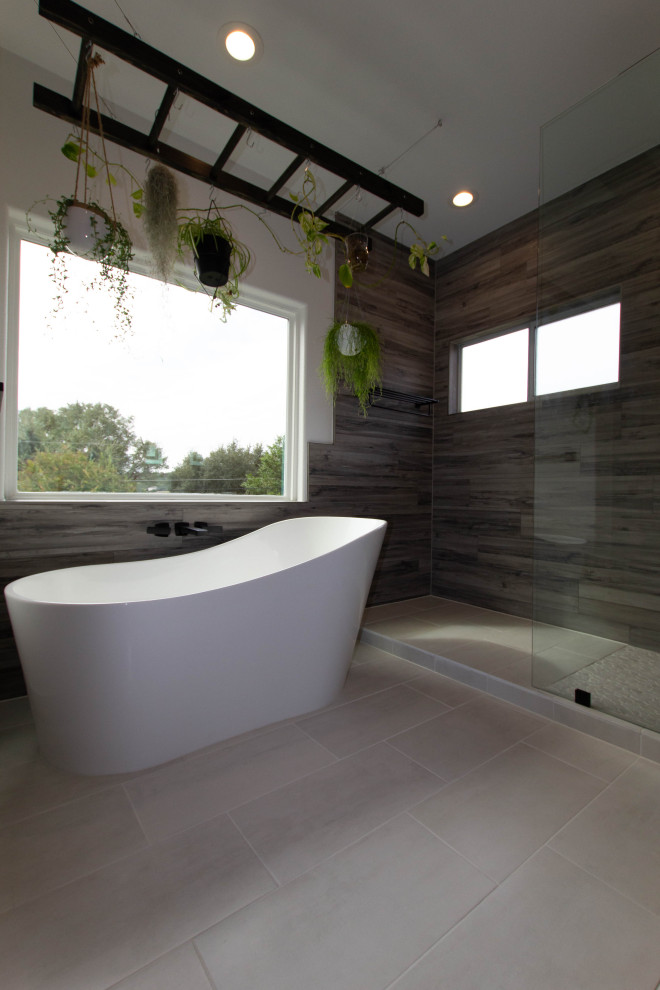 Photo of a modern master bathroom in Austin with flat-panel cabinets, black cabinets, a freestanding tub, an open shower, black and white tile, grey walls, ceramic floors, an undermount sink, quartzite benchtops, white floor, an open shower, white benchtops, a niche, a double vanity and a floating vanity.