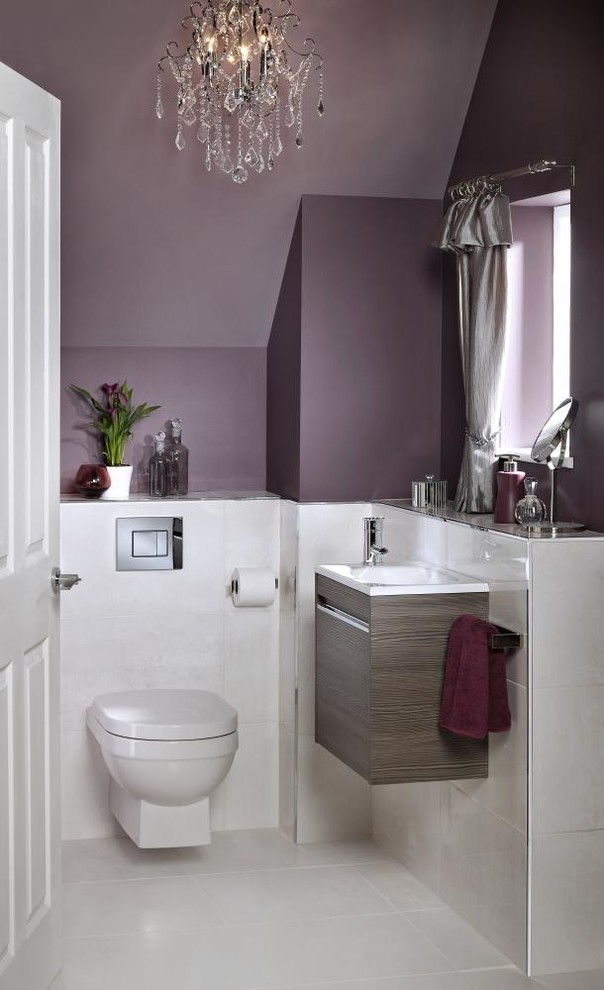 Inspiration for a small contemporary powder room in Other with flat-panel cabinets, light wood cabinets, a wall-mount toilet, white tile, purple walls, porcelain floors, a wall-mount sink and white floor.