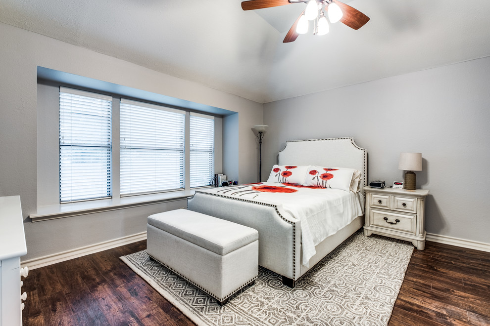 Example of a transitional master bedroom design in Austin