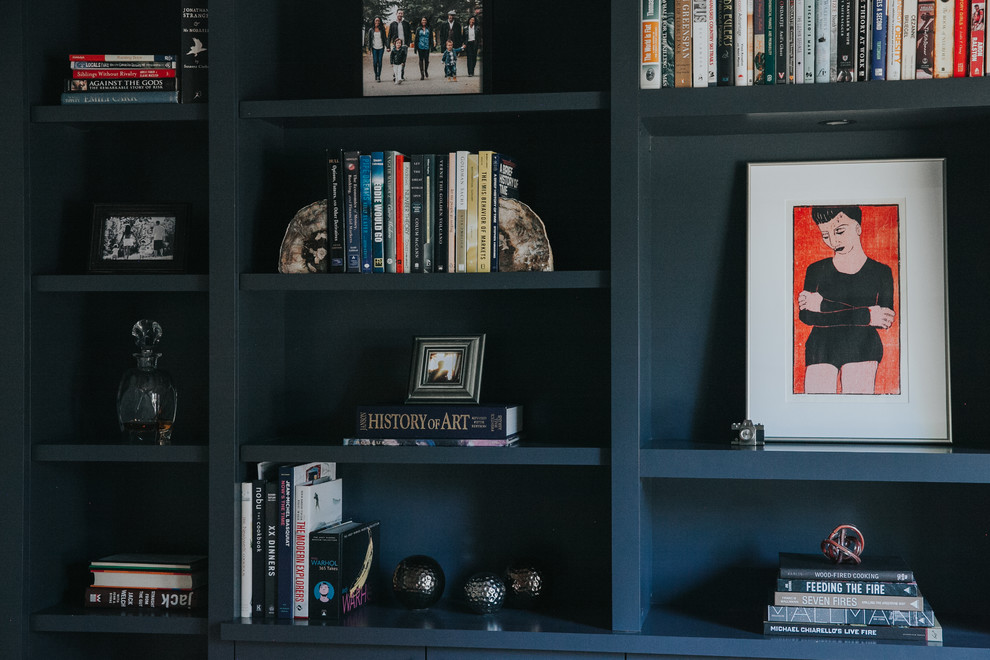Example of a transitional home design design in Calgary