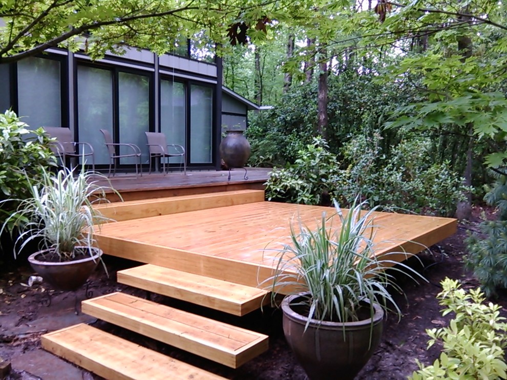 Inspiration for a small transitional backyard deck remodel in Raleigh with no cover