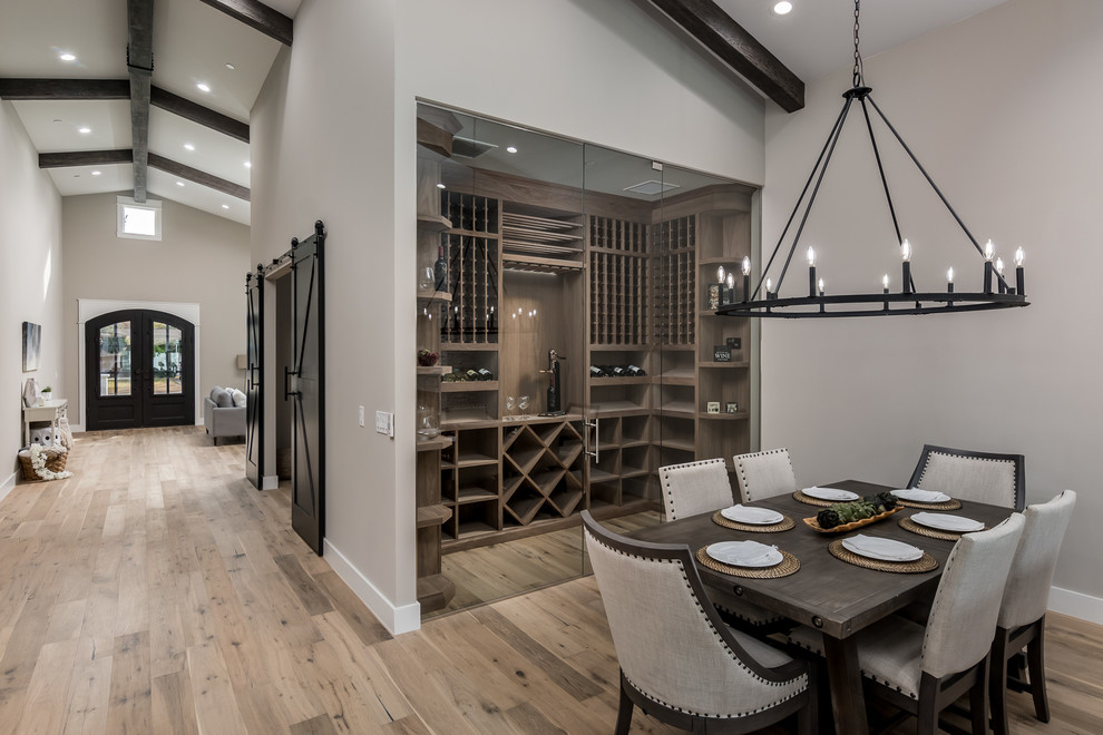 This is an example of a transitional open plan dining in Phoenix with grey walls, medium hardwood floors, no fireplace and brown floor.
