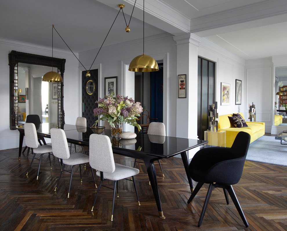 Photo of a contemporary open plan dining in New York with white walls, dark hardwood floors and brown floor.
