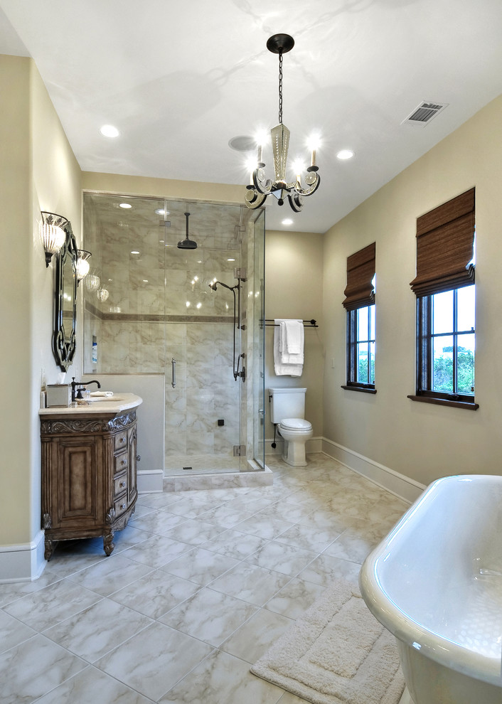 This is an example of a traditional bathroom in Charleston with a freestanding tub and an alcove shower.