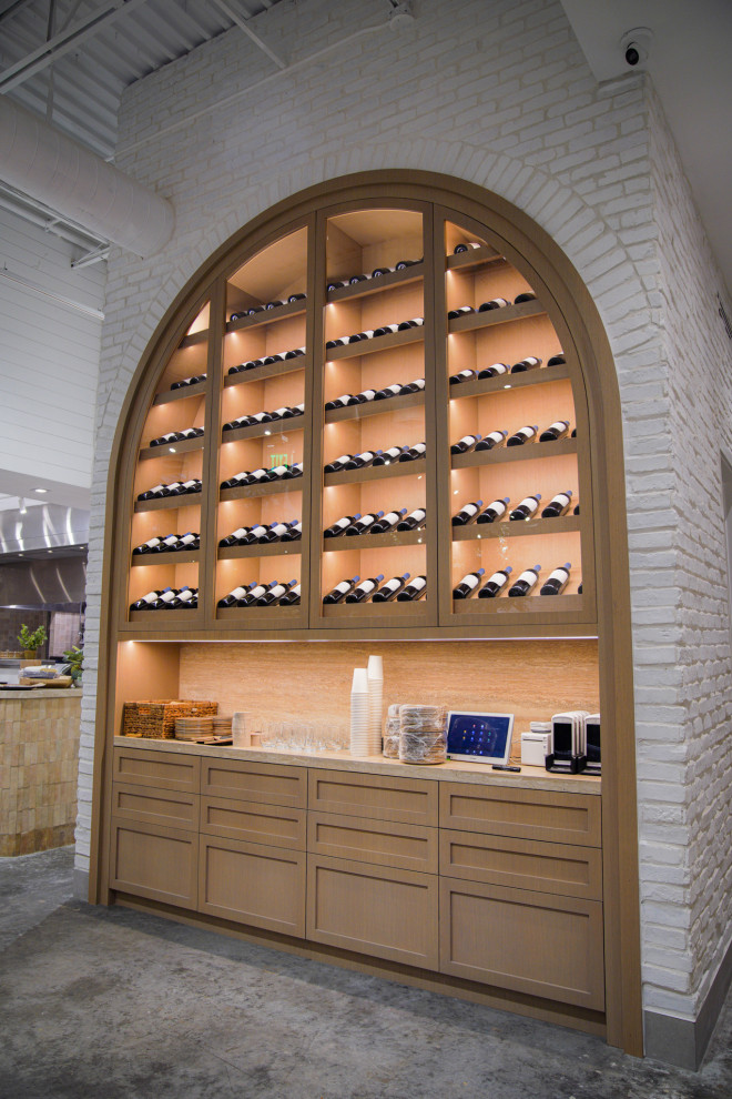 Photo of a traditional wine cellar in Miami with display racks.