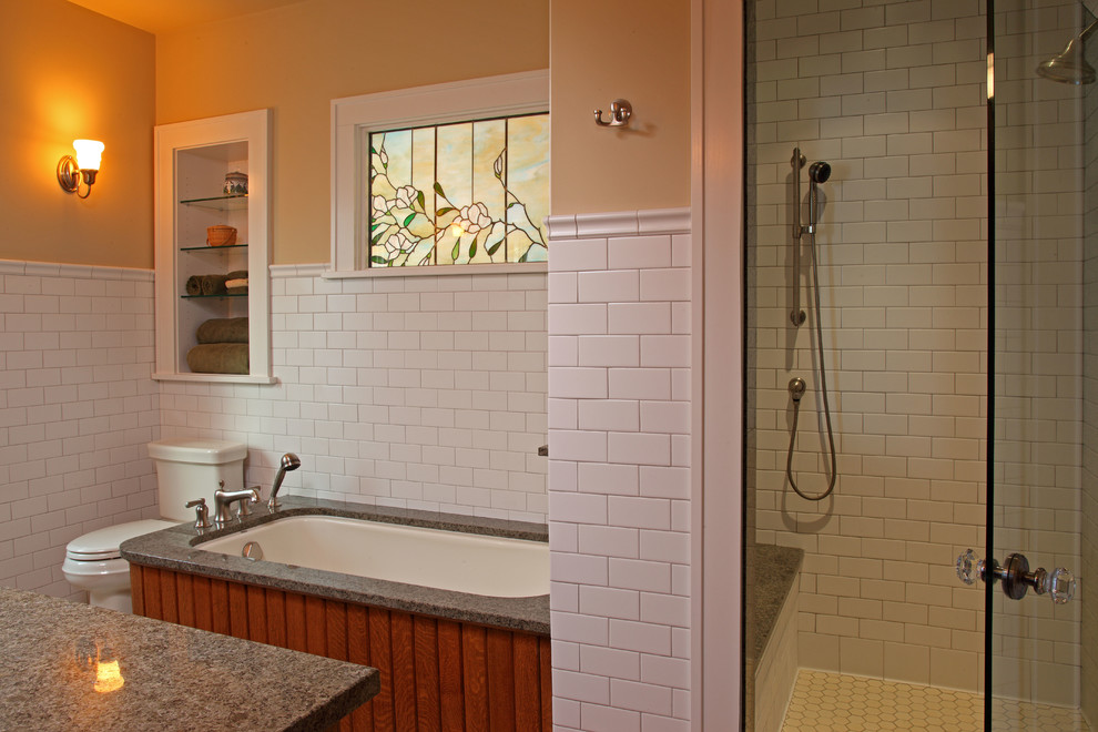 Design ideas for an arts and crafts master bathroom in Minneapolis with an undermount tub, an alcove shower, white tile, subway tile, a two-piece toilet, yellow walls and an undermount sink.