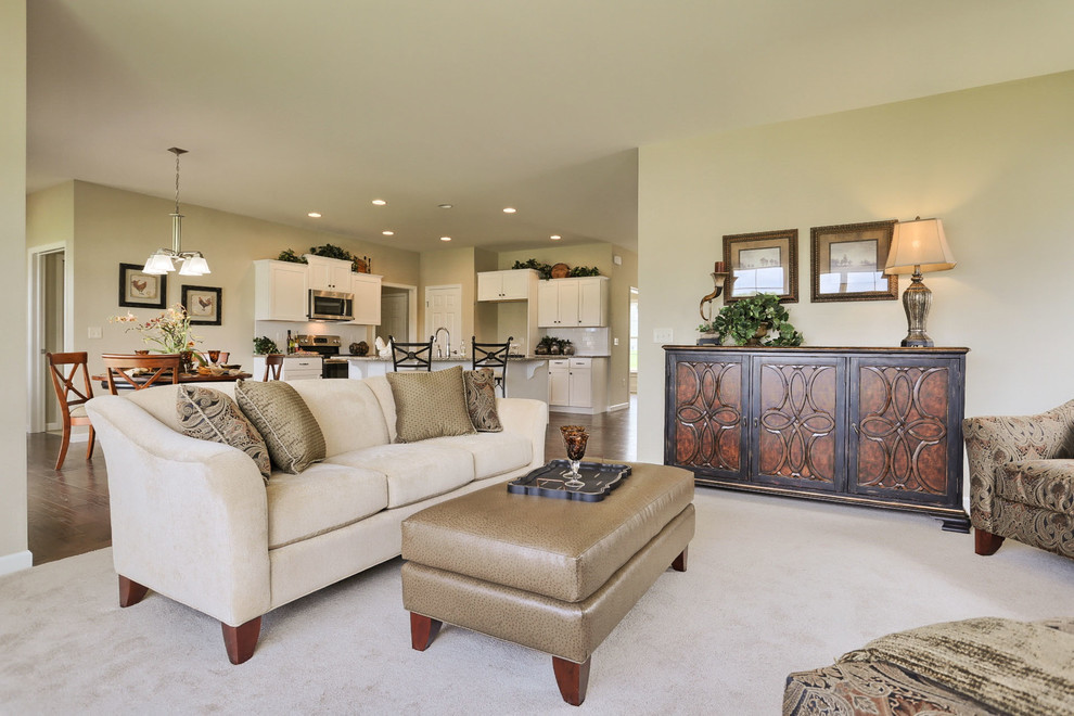 Inspiration for a large traditional open concept family room in Other with beige walls, carpet, a standard fireplace, a stone fireplace surround and beige floor.