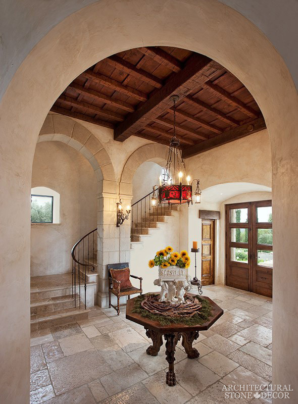 Design ideas for a mid-sized mediterranean entry hall in Toronto with multi-coloured walls and limestone floors.