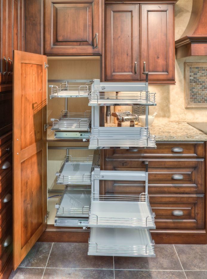 Eat-in kitchen - large rustic u-shaped porcelain tile eat-in kitchen idea in Toronto with an undermount sink, raised-panel cabinets, brown cabinets, quartz countertops, beige backsplash, stainless steel appliances and an island