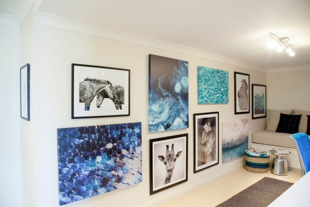 Inspiration for a mid-sized contemporary study room in Sydney with white walls, porcelain floors and a built-in desk.