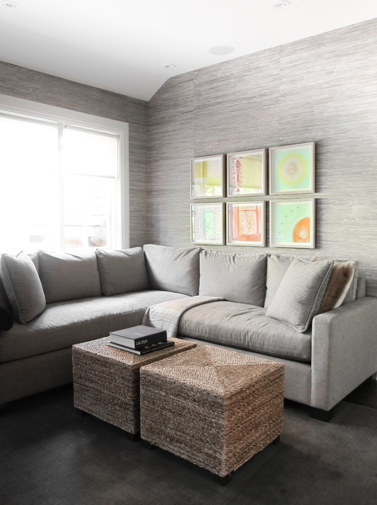 Photo of a mid-sized transitional enclosed family room in Toronto with grey walls and carpet.