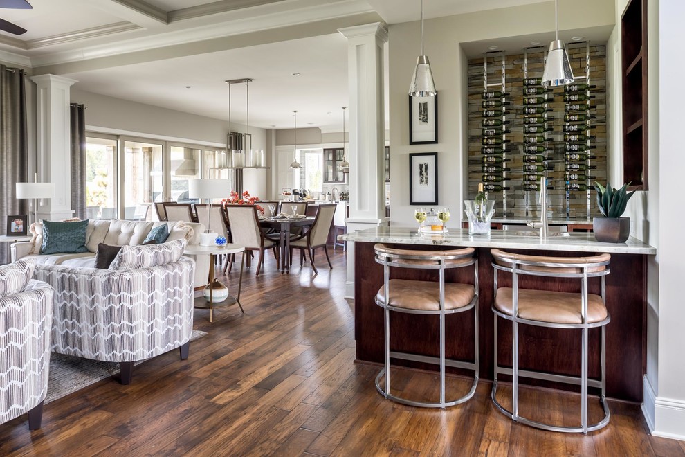 Large transitional home bar in Nashville with bamboo floors and brown floor.